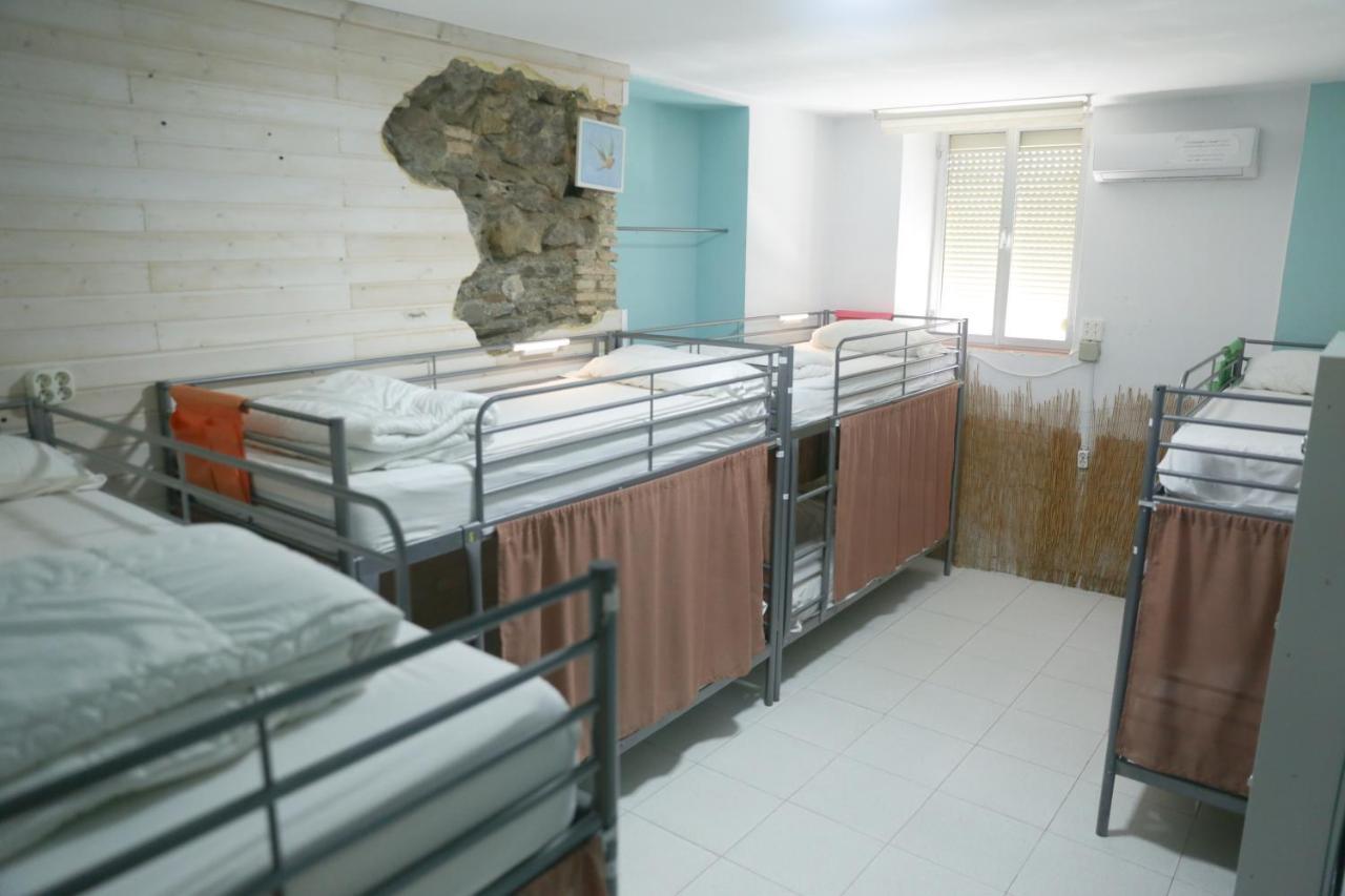 Cama en habitación compartida de 8 camas
