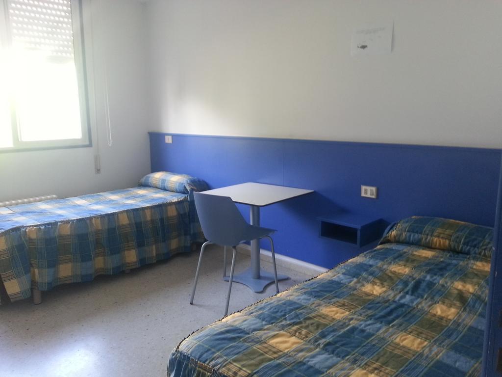 Cama individual en habitación compartida