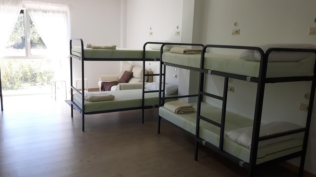 Cama individual en habitación compartida mixta