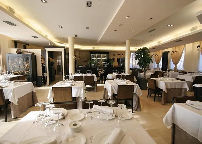 Hotel Asador H.M. Versus